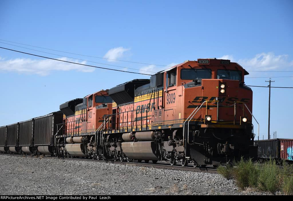 Loaded coal train rolls east